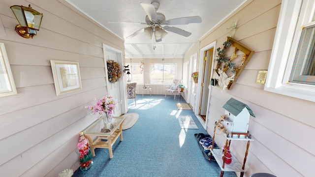 sunroom with ceiling fan