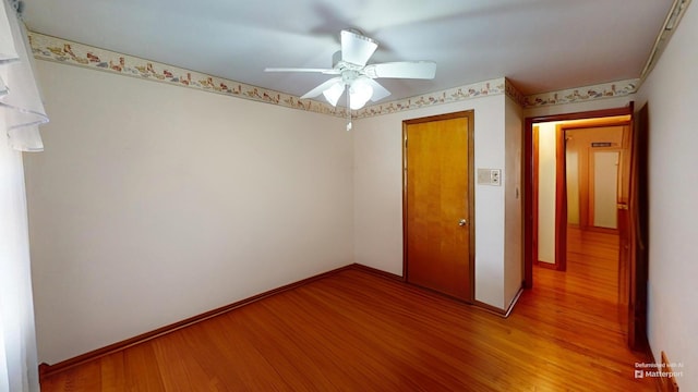 unfurnished bedroom featuring hardwood / wood-style flooring and ceiling fan