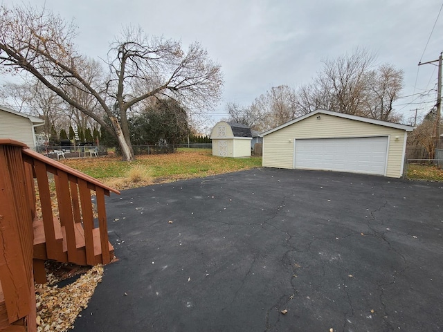 exterior space with a shed and a garage