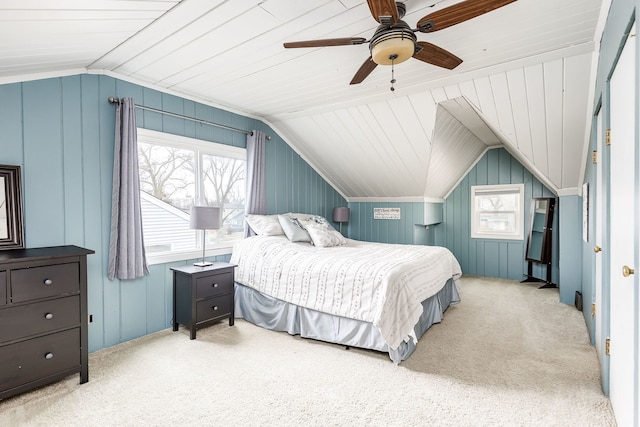 bedroom featuring vaulted ceiling, light colored carpet, and ceiling fan