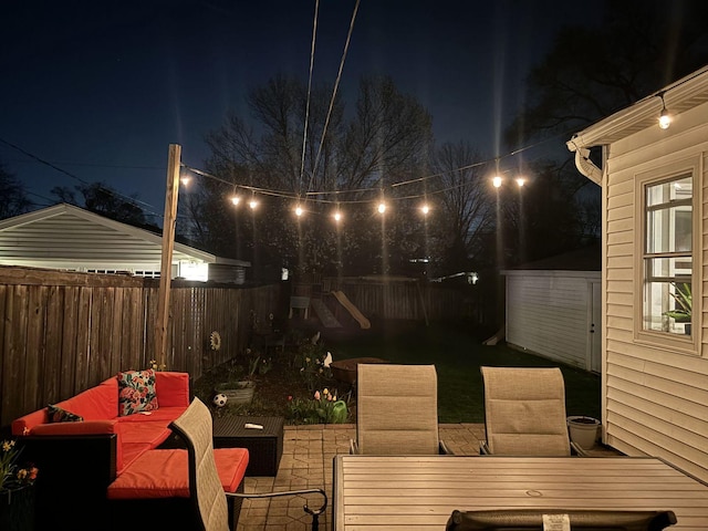 patio at night with outdoor lounge area