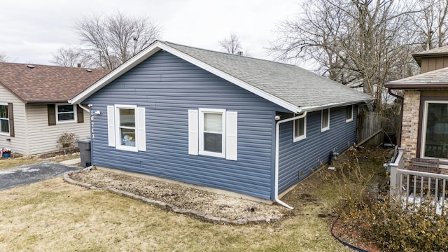 view of home's exterior with a yard