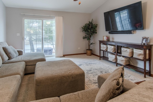 living room featuring light carpet, vaulted ceiling, and ceiling fan