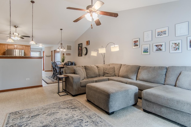 living room with ceiling fan and high vaulted ceiling