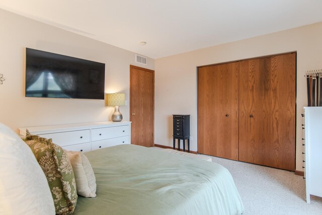 carpeted bedroom with a closet