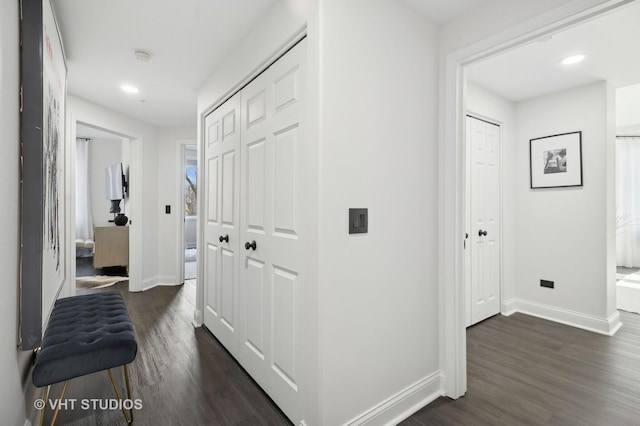 hallway with dark hardwood / wood-style floors