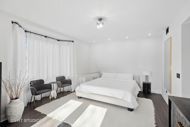 bedroom featuring dark hardwood / wood-style flooring