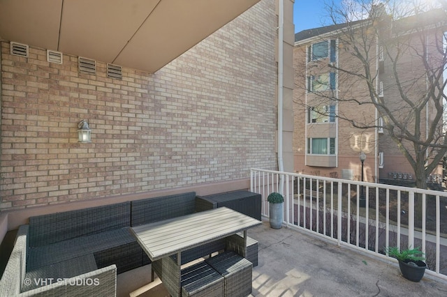 view of patio / terrace with an outdoor living space and a balcony