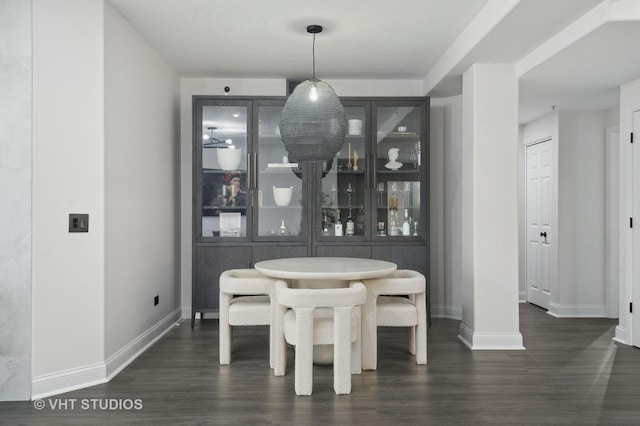 dining area featuring dark hardwood / wood-style flooring