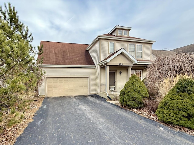 view of front of property with a garage