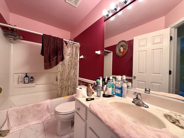 full bathroom featuring tile patterned flooring, vanity, toilet, and shower / tub combo with curtain