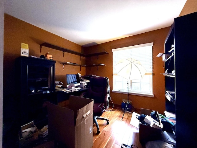 office space with light wood-type flooring