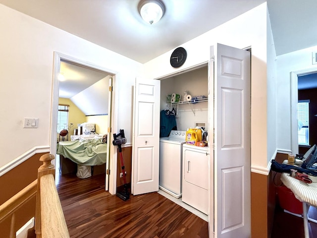 interior space with separate washer and dryer and dark wood-type flooring