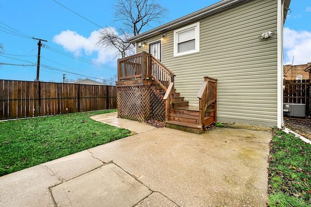 back of property featuring a patio area and a lawn