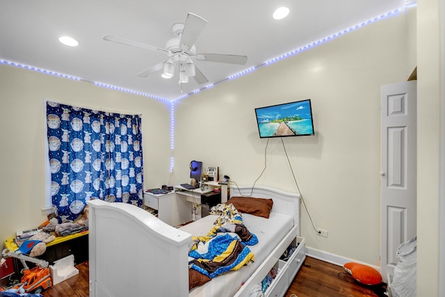 home office with ceiling fan and dark hardwood / wood-style floors