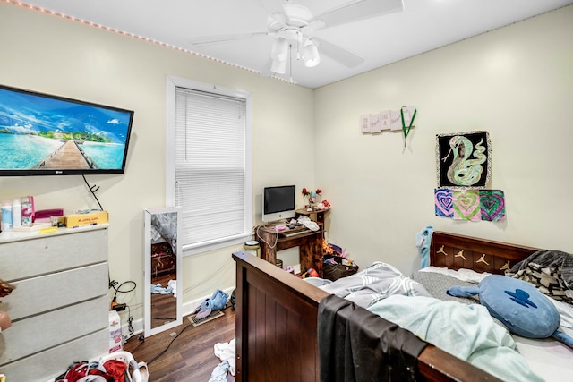 bedroom with ceiling fan and dark hardwood / wood-style flooring