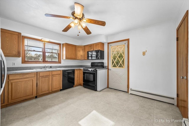 kitchen with a sink, a ceiling fan, baseboard heating, brown cabinets, and black appliances