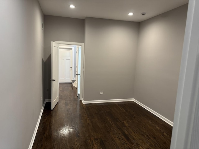 spare room featuring dark hardwood / wood-style flooring