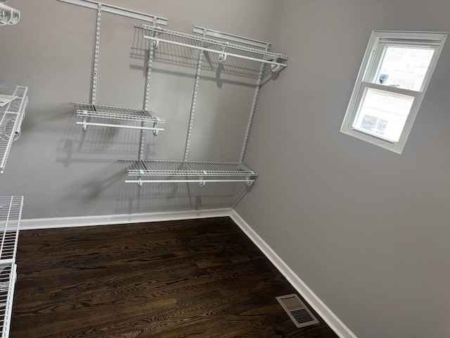 spacious closet featuring hardwood / wood-style flooring