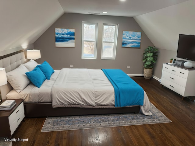 bedroom featuring lofted ceiling and dark hardwood / wood-style flooring