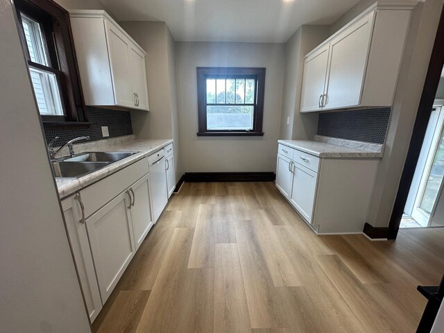 spare room with a baseboard heating unit, crown molding, and wood-type flooring