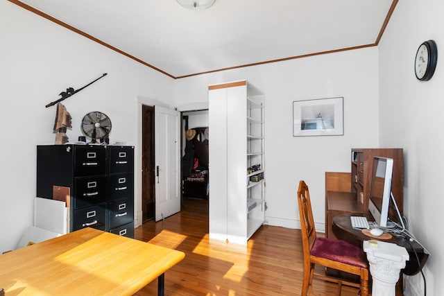 home office featuring crown molding and wood-type flooring