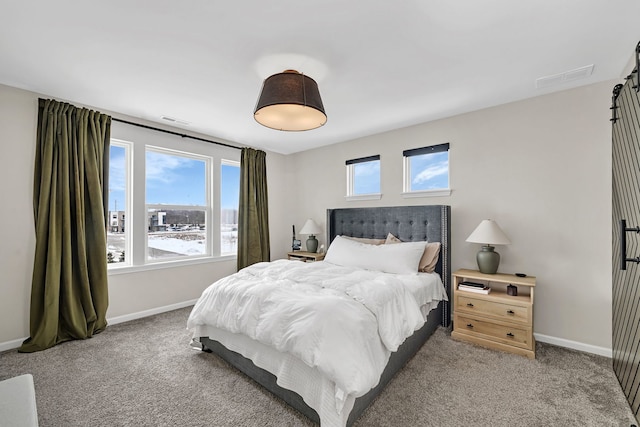 carpeted bedroom with visible vents and baseboards