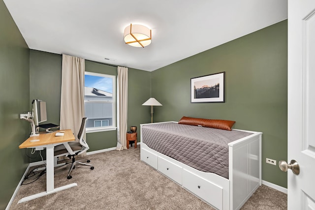 carpeted bedroom featuring visible vents and baseboards