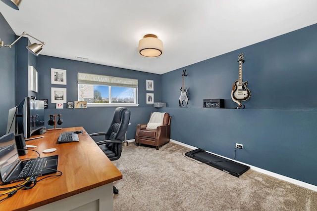 carpeted home office with visible vents and baseboards