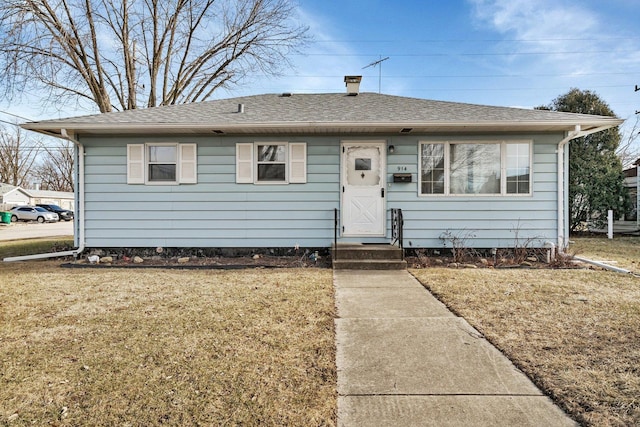 bungalow with a front yard