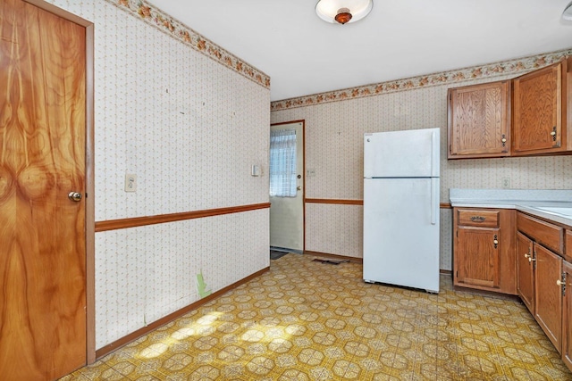 kitchen featuring white fridge