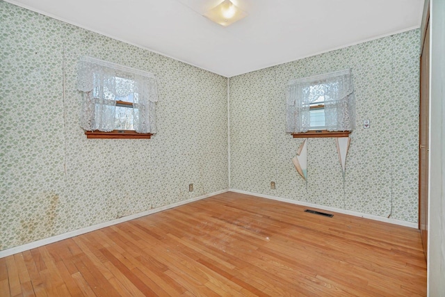 empty room featuring hardwood / wood-style floors