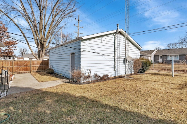 view of outbuilding featuring a lawn