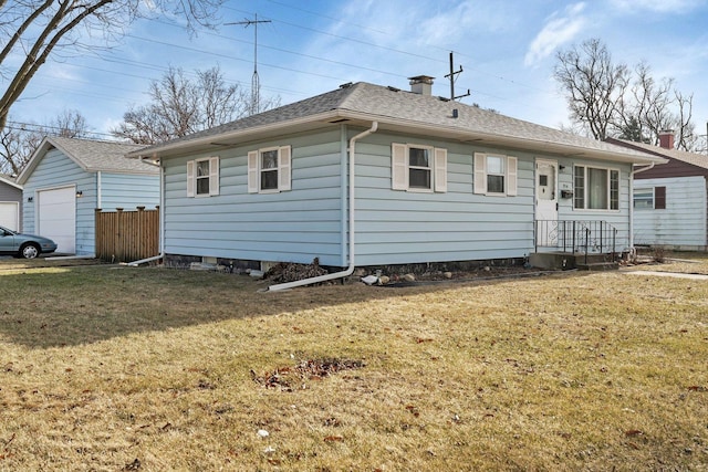 view of front of house featuring a garage and a front yard