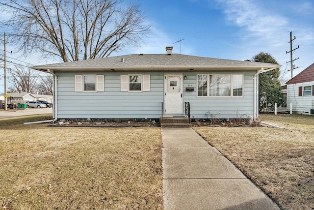 view of front of home with a front yard