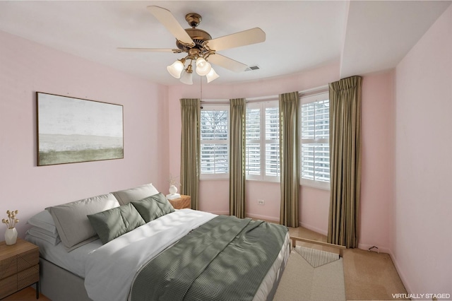 bedroom with ceiling fan and carpet floors