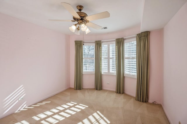 carpeted empty room with ceiling fan