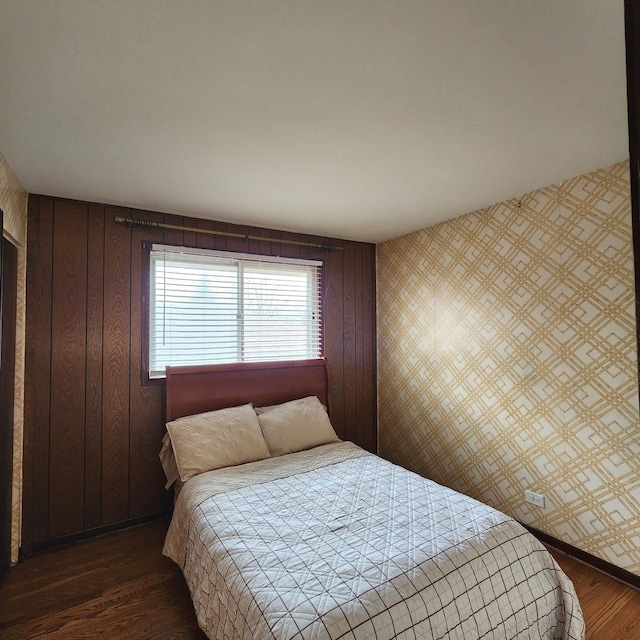 bedroom featuring dark hardwood / wood-style flooring