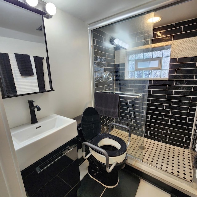 bathroom featuring sink and a shower with shower door