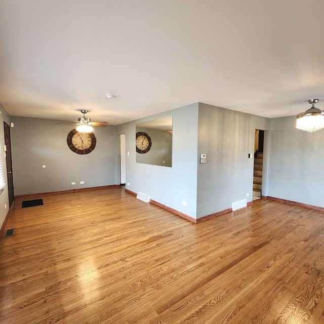 unfurnished room featuring ceiling fan and light hardwood / wood-style flooring