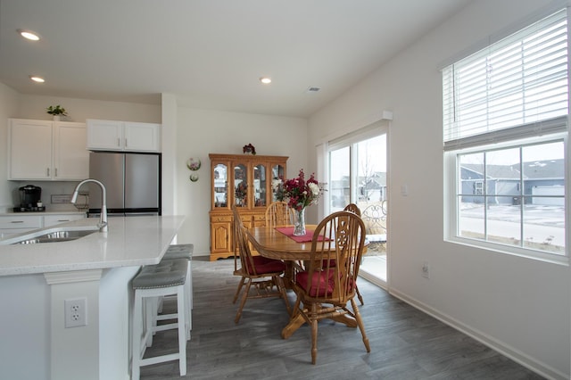 dining area featuring dark hardwood / wood-style floors and sink