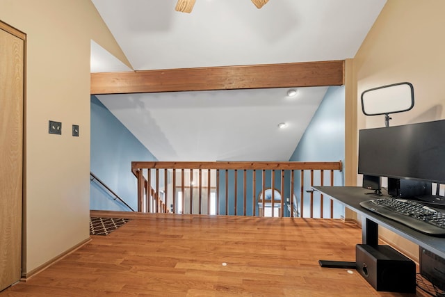 hallway featuring lofted ceiling with beams and light hardwood / wood-style floors