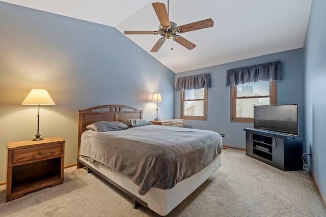 carpeted bedroom with ceiling fan and lofted ceiling