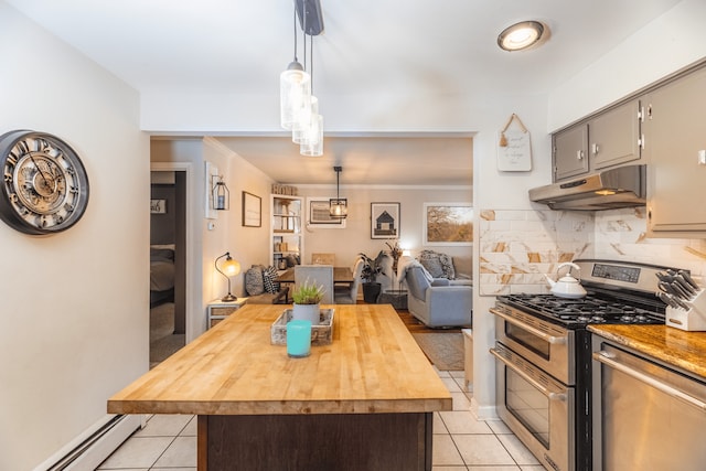 kitchen with a kitchen island, appliances with stainless steel finishes, a baseboard heating unit, and hanging light fixtures