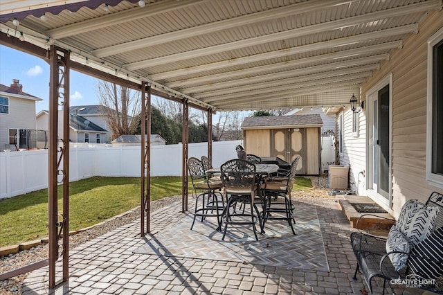 view of patio / terrace with a shed