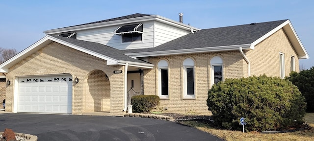 view of front of property with a garage