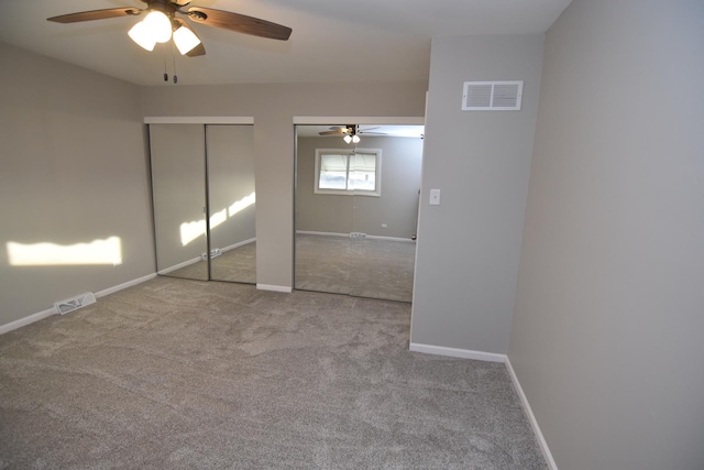 16701 Clyde Ave, South Holland, IL 60473 - unfurnished bedroom featuring two closets, carpet flooring, and a ceiling fan