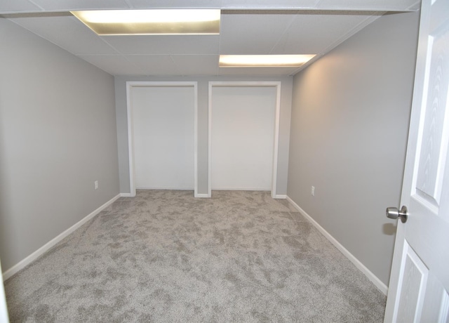 16701 Clyde Ave, South Holland, IL 60473 - unfurnished bedroom featuring carpet floors, two closets, and a paneled ceiling