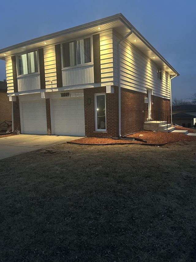 property exterior at dusk with a garage