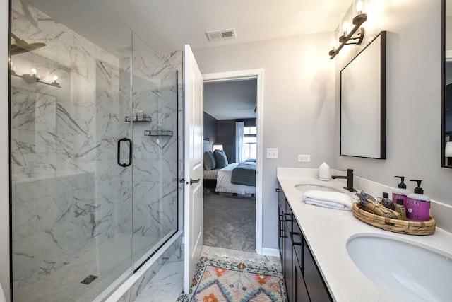 bathroom featuring walk in shower and vanity